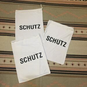 Three (3) Schutz white w/ black lettering soft material Dust bag 14” x 10”